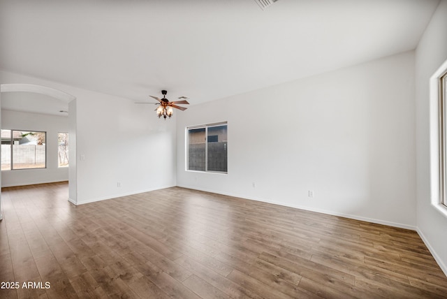 spare room featuring ceiling fan and hardwood / wood-style floors