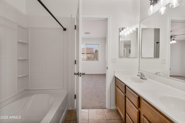 bathroom featuring tile patterned flooring, vanity, shower / washtub combination, and ceiling fan