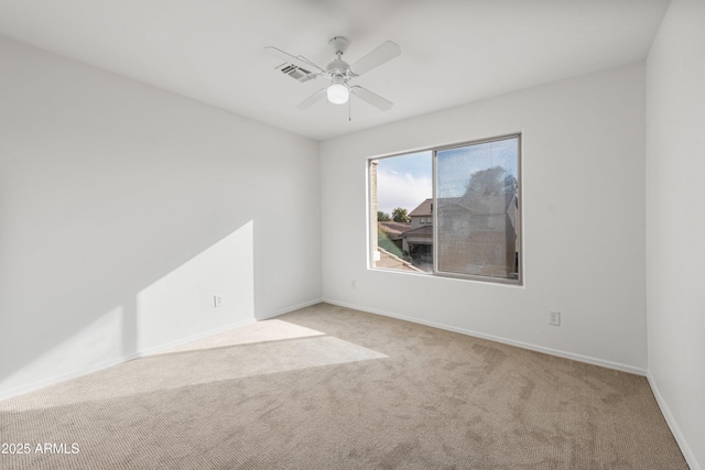 carpeted empty room with ceiling fan