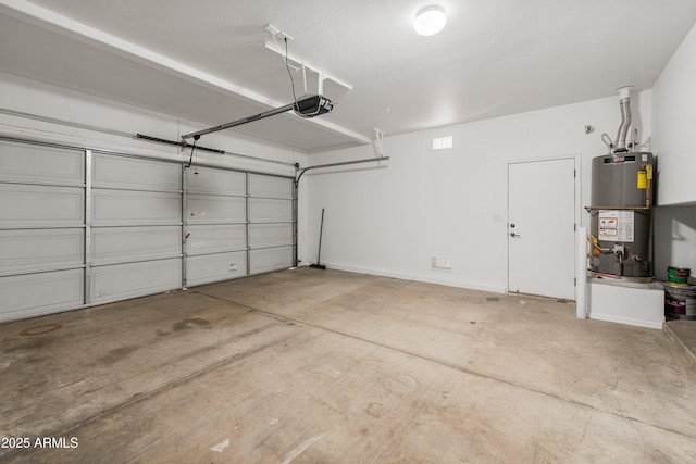 garage featuring a garage door opener and water heater