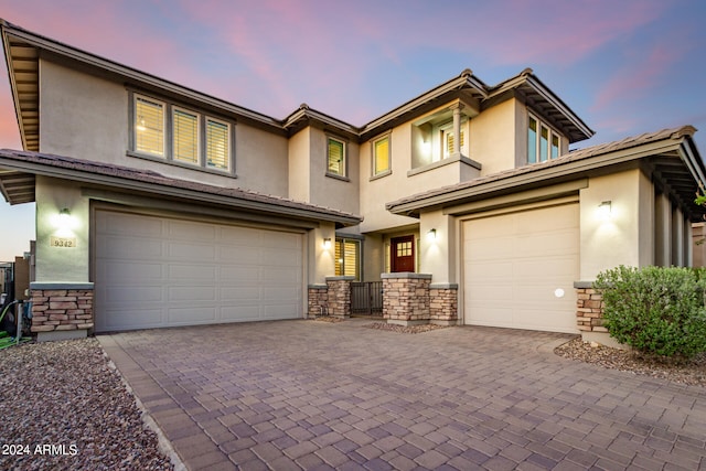 view of front of property with a garage