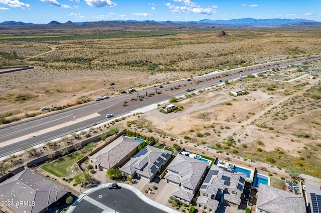 birds eye view of property with a mountain view