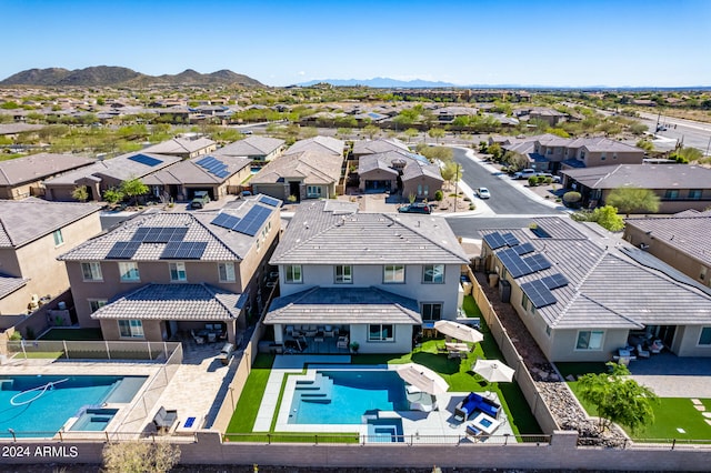 birds eye view of property with a mountain view