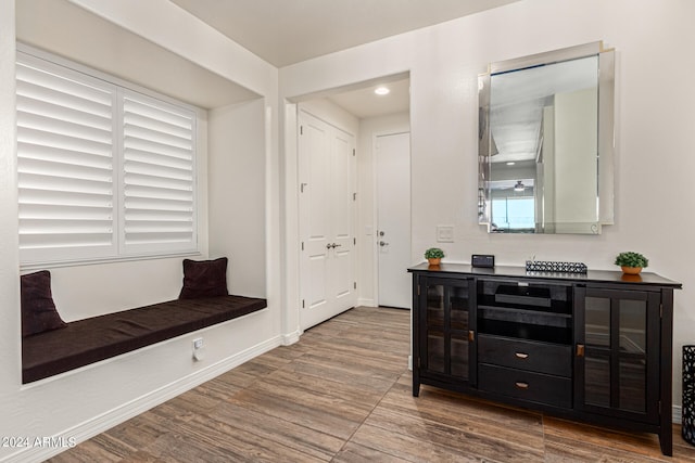 mudroom with plenty of natural light and hardwood / wood-style flooring