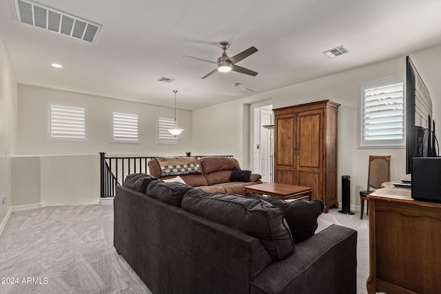 living room with light carpet and ceiling fan