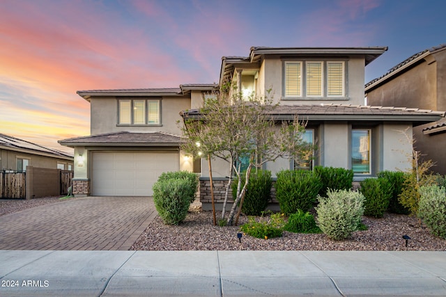 prairie-style house featuring a garage