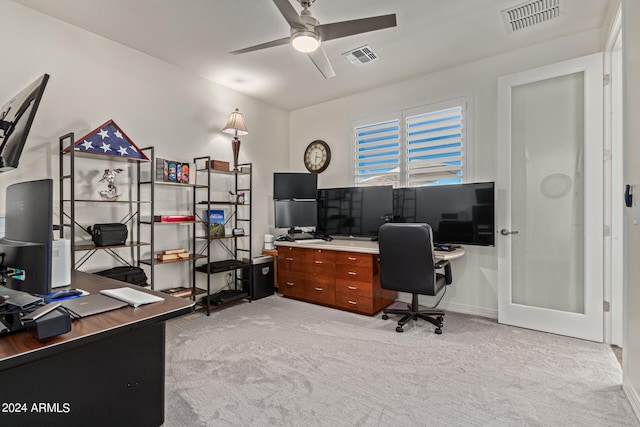 office space with ceiling fan and light colored carpet