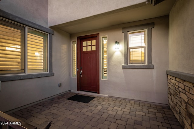 entrance to property with a patio area