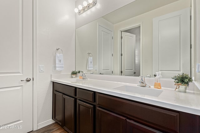 bathroom with wood-type flooring and vanity