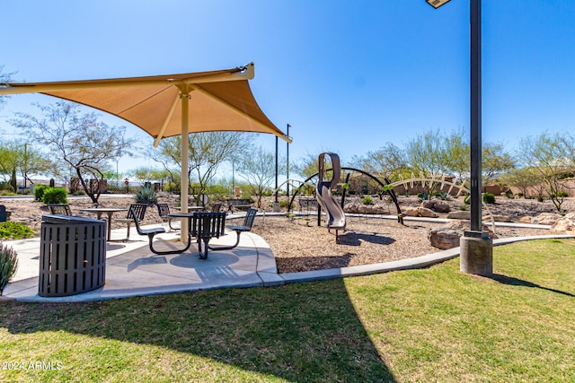 view of play area featuring a lawn