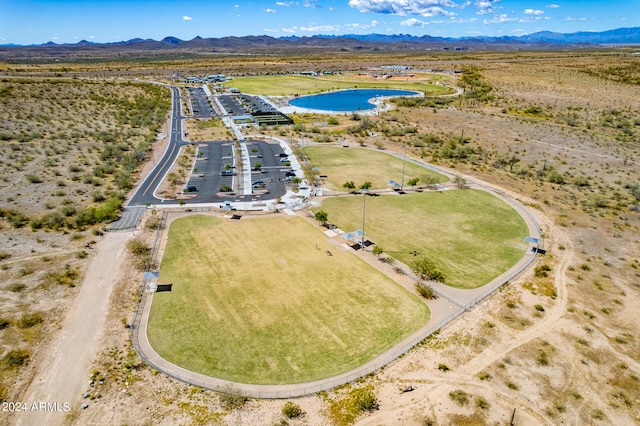 bird's eye view with a water and mountain view