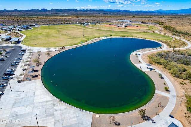 birds eye view of property featuring a water and mountain view