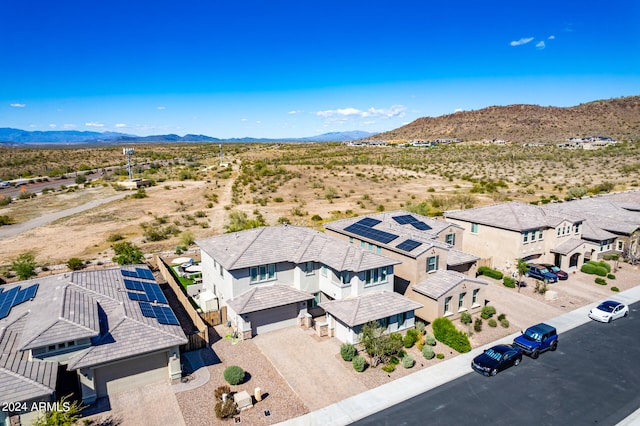 birds eye view of property featuring a mountain view