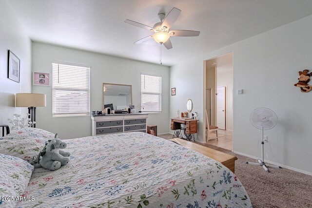 bedroom featuring light carpet and ceiling fan