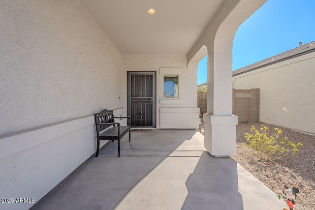 entrance to property with a patio area