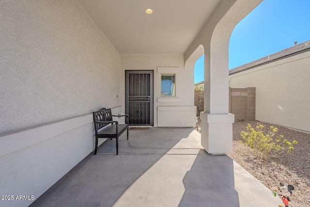 entrance to property with a patio area