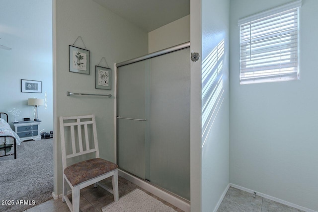 bathroom with a shower with shower door