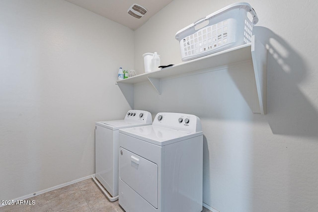 clothes washing area with washing machine and clothes dryer