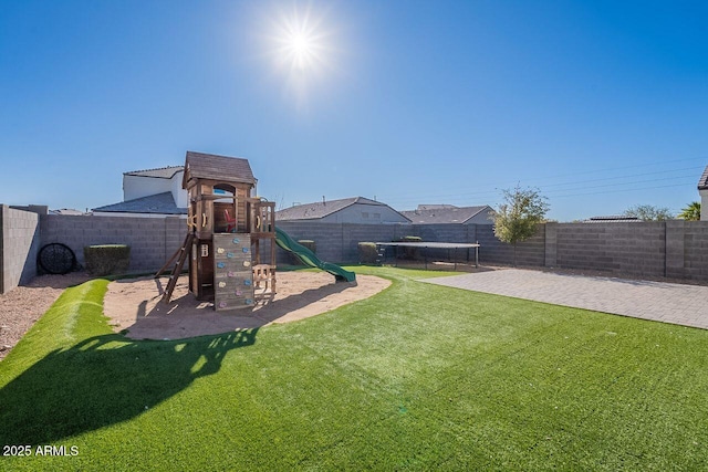 exterior space with a yard and a trampoline