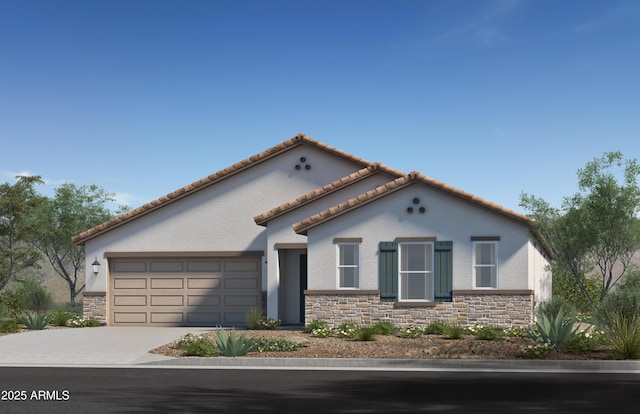 mediterranean / spanish house with an attached garage, stone siding, concrete driveway, and stucco siding