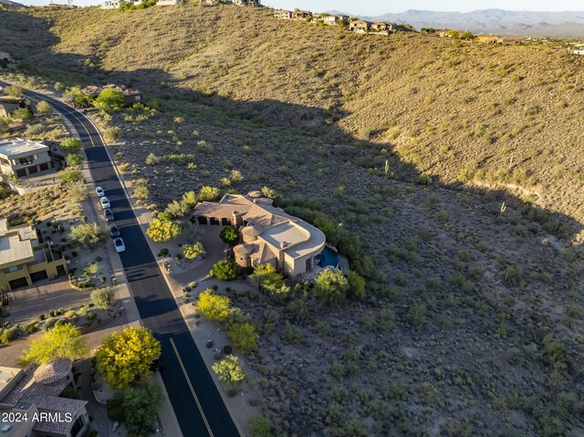 birds eye view of property with a mountain view