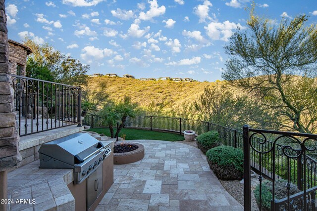 view of patio / terrace with area for grilling and fence private yard