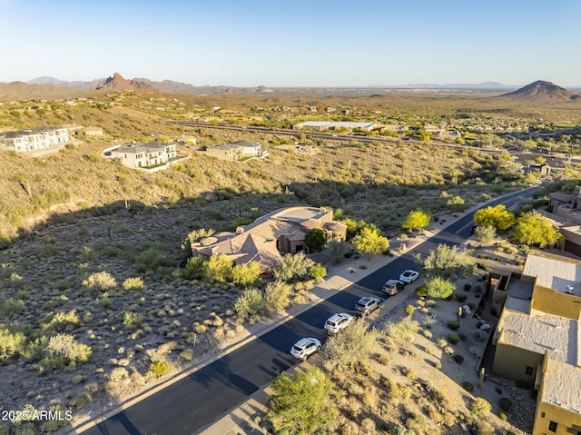 birds eye view of property with a mountain view