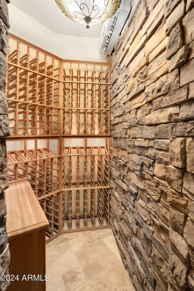 wine cellar featuring an AC wall unit