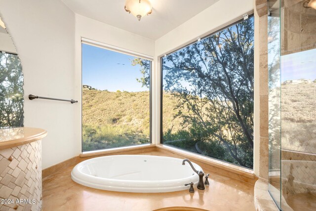 bathroom with a bath to relax in