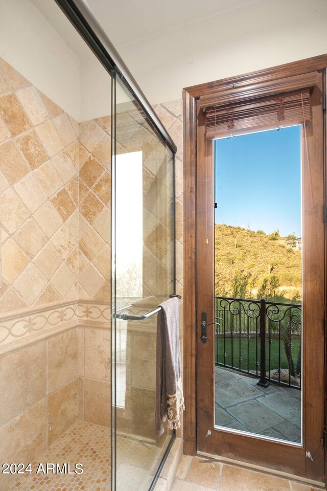 bathroom featuring an enclosed shower