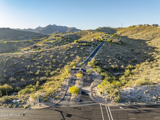 birds eye view of property with a mountain view