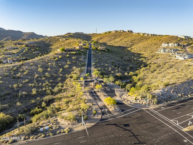 birds eye view of property with a mountain view