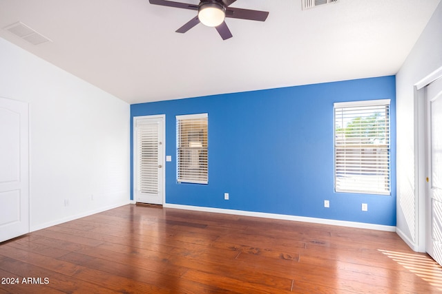 spare room with ceiling fan and wood-type flooring