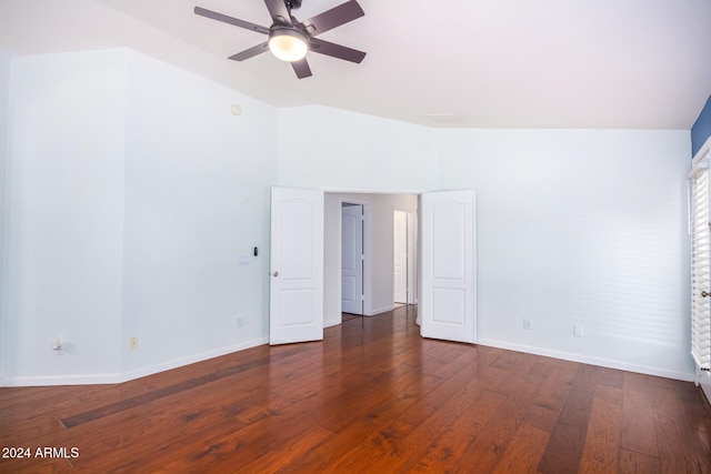 unfurnished room featuring dark hardwood / wood-style floors, ceiling fan, and lofted ceiling