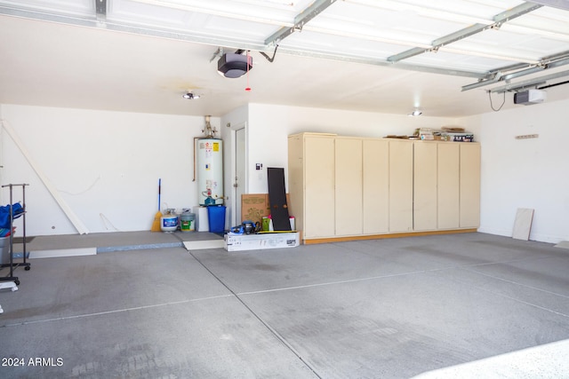 garage with a garage door opener and water heater