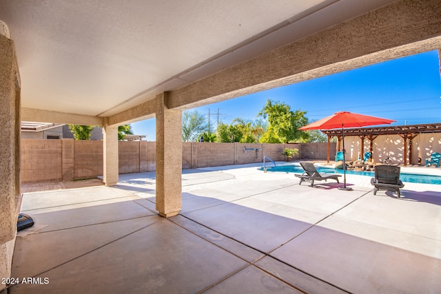 view of patio featuring a fenced in pool