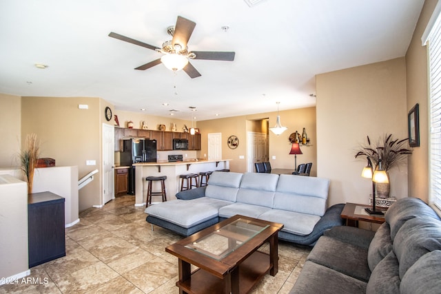 living room with ceiling fan