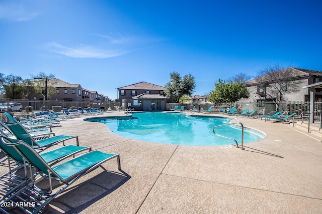 view of swimming pool with a patio