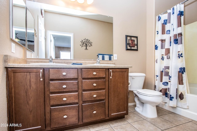 full bathroom featuring toilet, vanity, shower / bath combination with curtain, and tile patterned floors