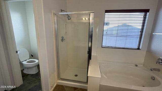 bathroom with toilet and plus walk in shower