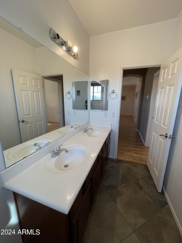 bathroom with vanity and wood-type flooring