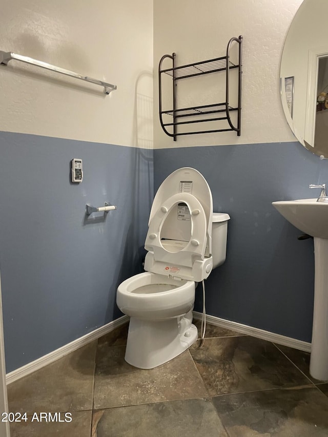 bathroom featuring toilet