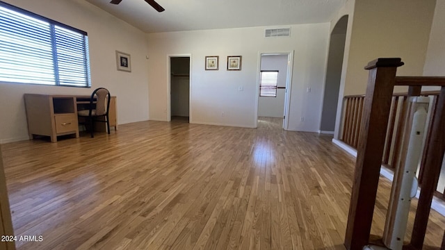 interior space with plenty of natural light, hardwood / wood-style floors, and ceiling fan