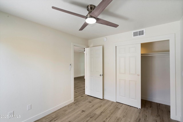 unfurnished bedroom with light wood finished floors, baseboards, a closet, and ceiling fan