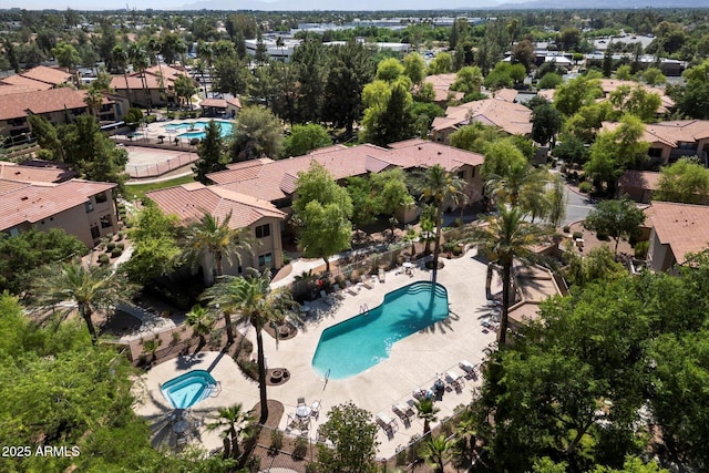 aerial perspective of suburban area featuring a pool