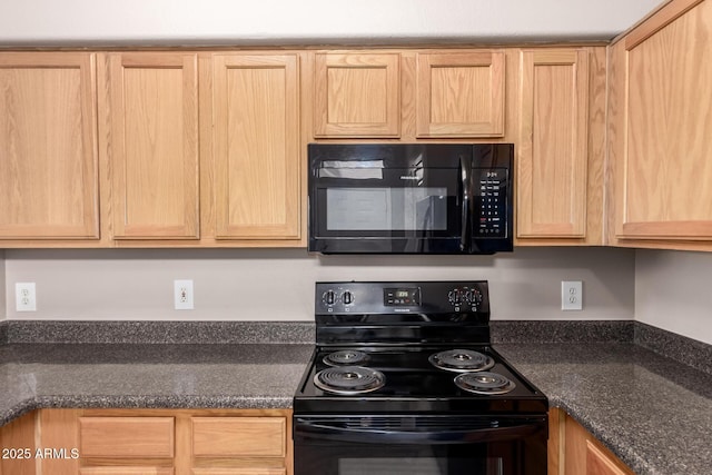 kitchen featuring light brown cabinetry and black appliances