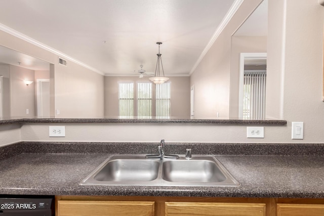 kitchen featuring a sink, crown molding, black dishwasher, and visible vents