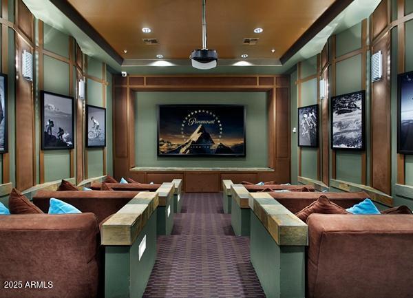 carpeted home theater with recessed lighting, visible vents, and a raised ceiling