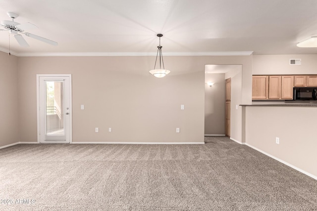 unfurnished living room featuring baseboards, ornamental molding, carpet, and ceiling fan