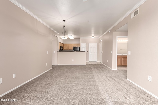 unfurnished living room with baseboards, ornamental molding, carpet, and visible vents